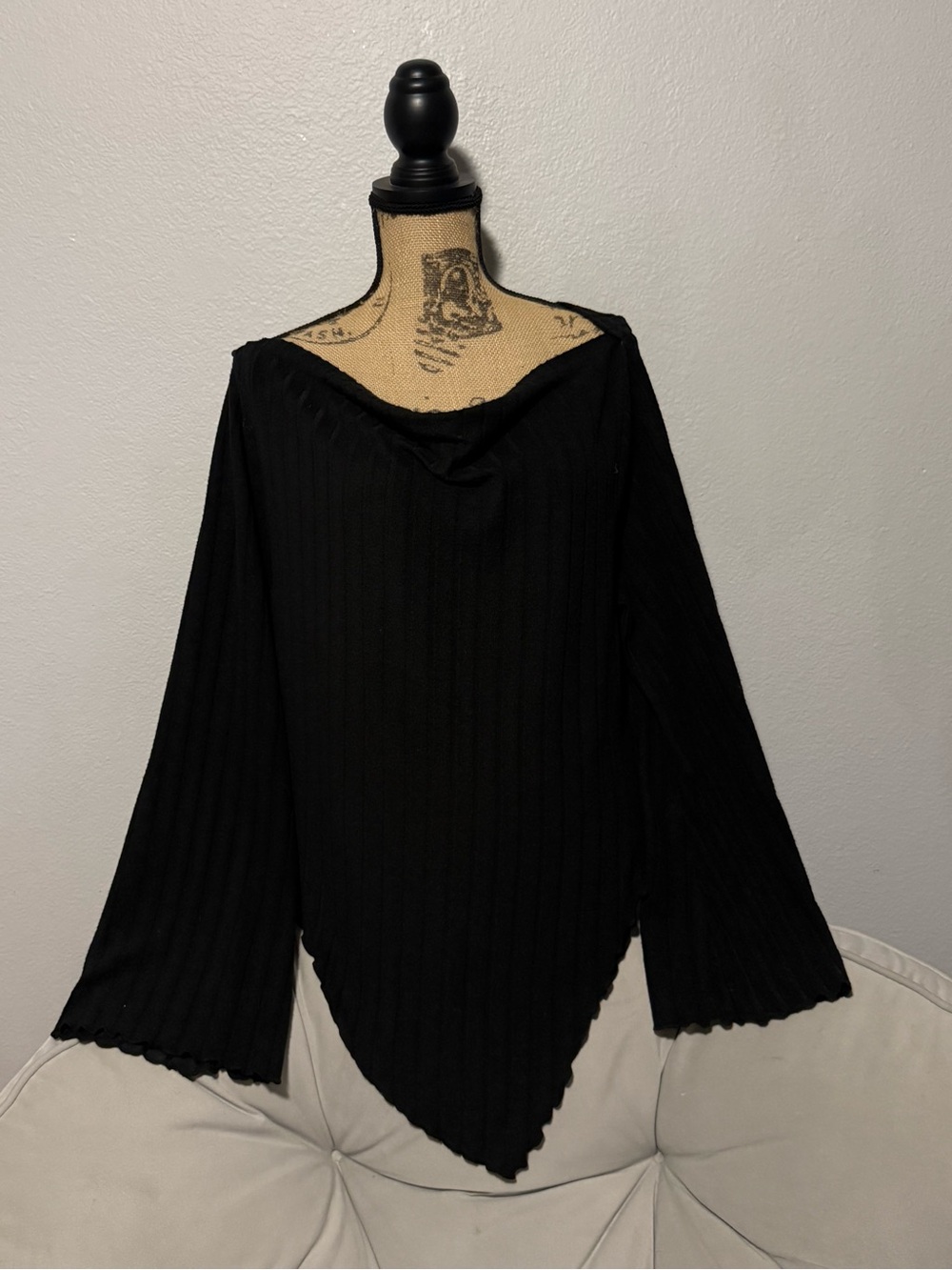 Off-the-Shoulder Black Ribbed Point-Hem Sweater with bell sleeves.
